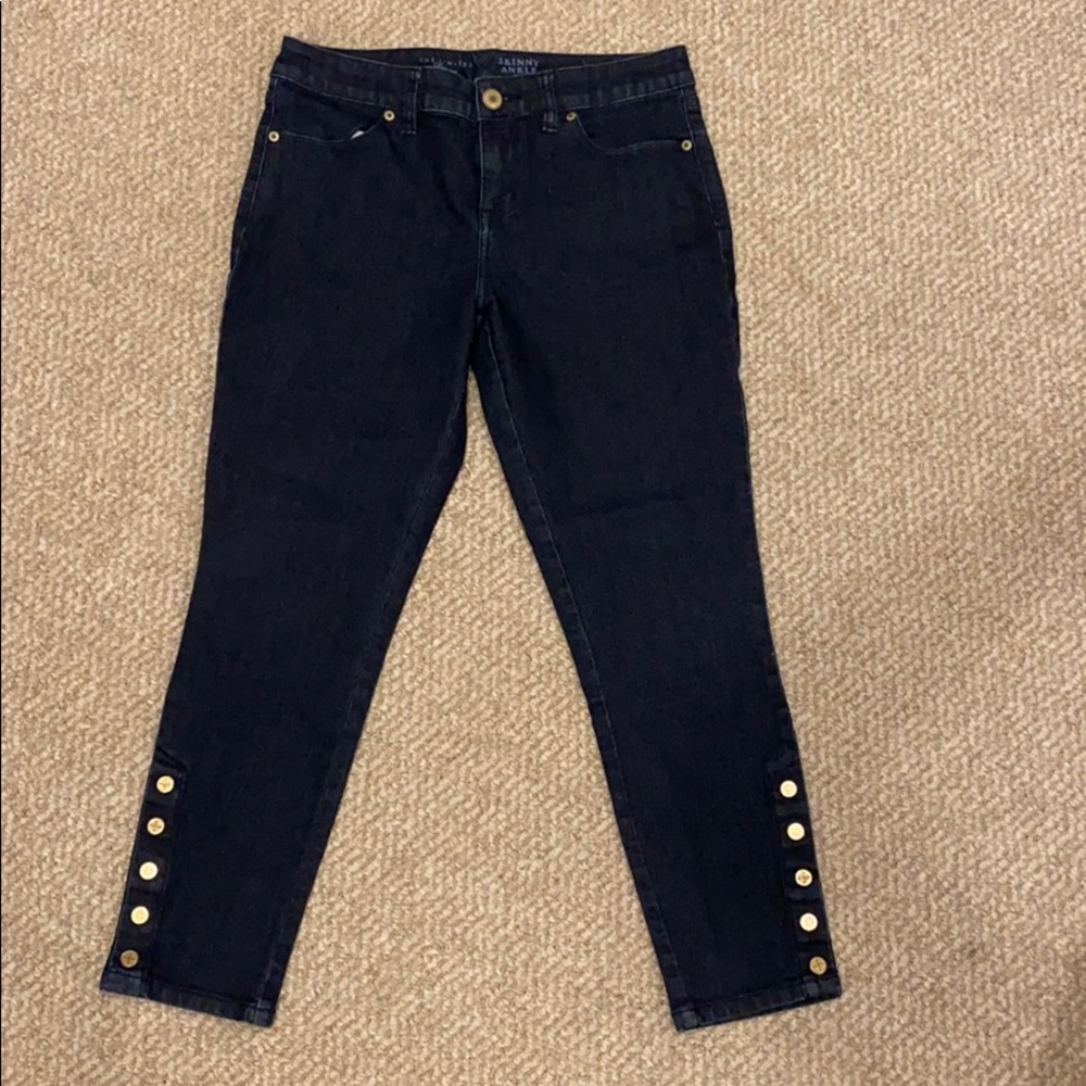 Skinny Ankle jeans with buttons at at bottom.